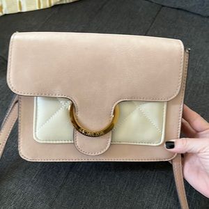 Crossbody/shoulder bag. Used a hand full of times.